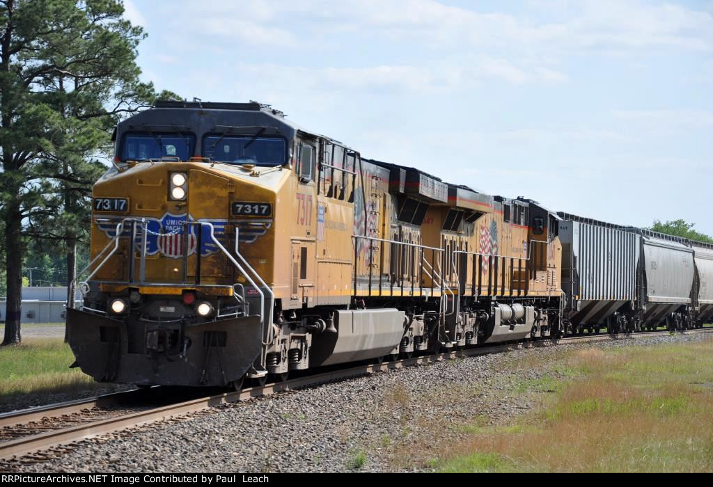 Grain train rolls east